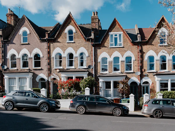 Edwardian red brick semis with gabled bays and white window arches