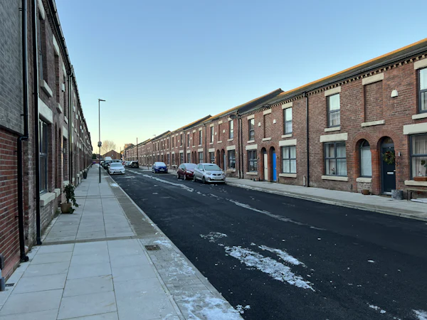 A Victorian brick terrace in winter sun, every house the same