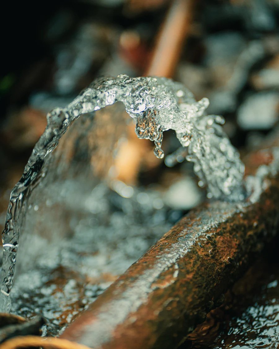 Water spraying from a split in a copper pipe