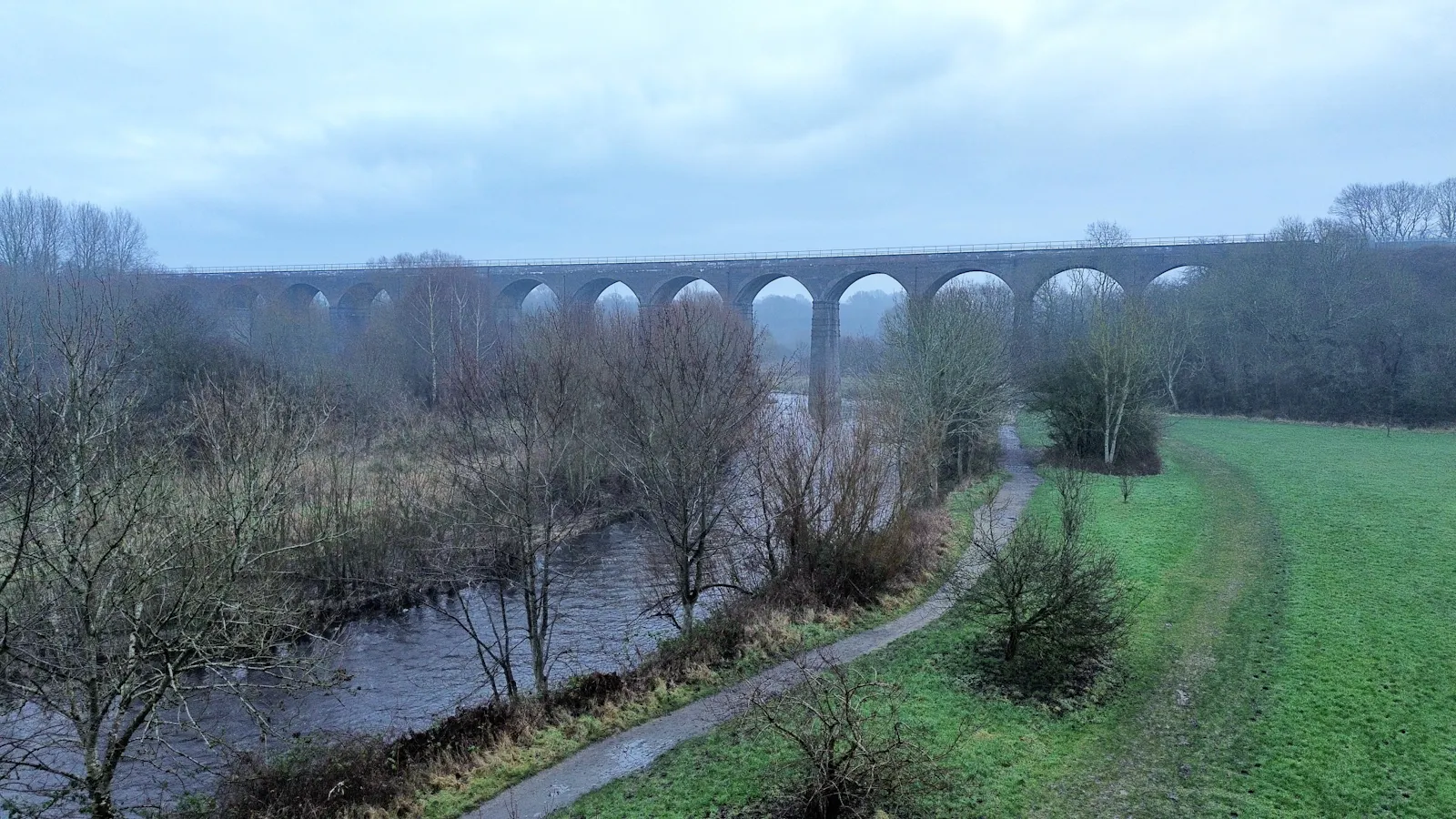The sixteen-arch railway viaduct over the river in Reddish Vale, Stockport